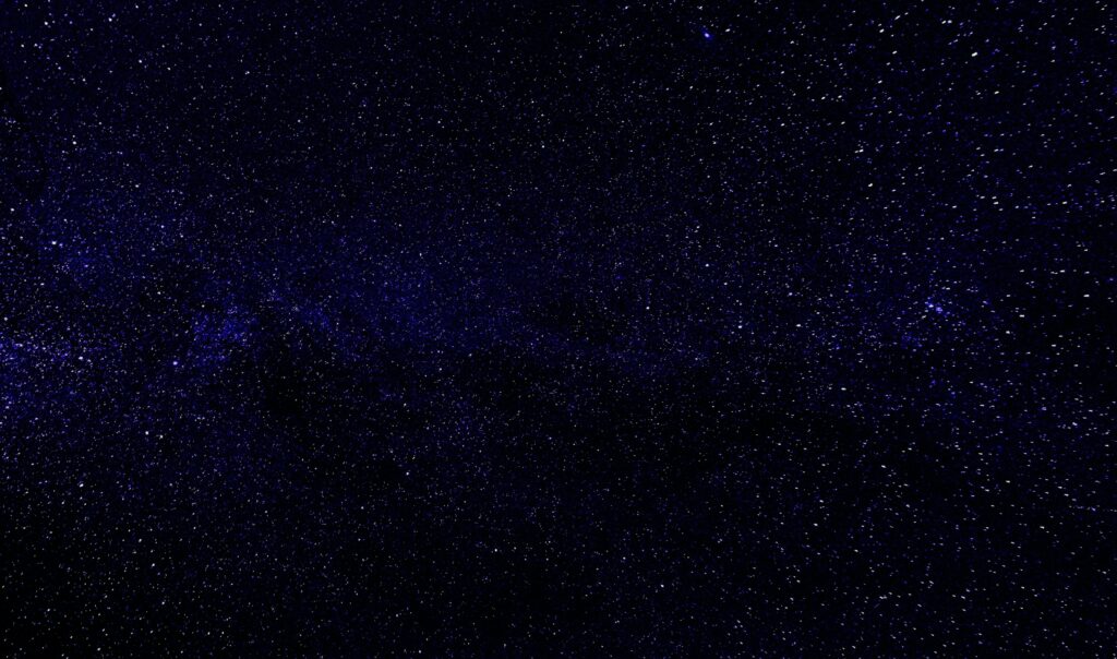 Explore the vast universe with this beautiful night sky filled with stars and galaxies.